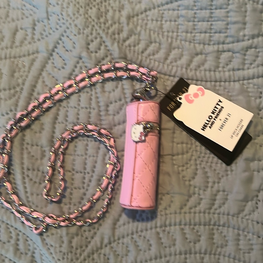 This is a lipgloss/Chapstick holder. With Hello Kitty,zipper pull.
